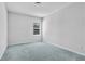 Clean, bright bedroom with a window and neutral carpet flooring at 3259 Ivy Crossing Dr, Buford, GA 30519