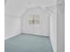 Walk in closet with custom shelving, carpet flooring, window, and a sloped ceiling at 3259 Ivy Crossing Dr, Buford, GA 30519