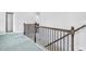 Hallway featuring wood and iron handrails, carpet flooring and white walls at 3259 Ivy Crossing Dr, Buford, GA 30519