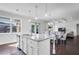 Open-concept kitchen and dining space with island, connecting to the living room at 3259 Ivy Crossing Dr, Buford, GA 30519