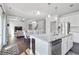 Bright kitchen with a granite island, stainless appliances, and open-concept layout at 3259 Ivy Crossing Dr, Buford, GA 30519