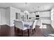 Well-lit kitchen and dining area with island and modern decor at 3259 Ivy Crossing Dr, Buford, GA 30519