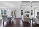 Open-concept living room featuring coffered ceiling, fireplace, and hardwood floors at 3259 Ivy Crossing Dr, Buford, GA 30519