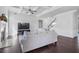 Cozy living area with fireplace and a ceiling fan, featuring a staircase at 3259 Ivy Crossing Dr, Buford, GA 30519