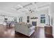 Inviting living room with a coffered ceiling, fireplace, and seamless flow into the dining area and kitchen at 3259 Ivy Crossing Dr, Buford, GA 30519