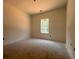 Bedroom with a large window for great natural light at 610 Presley Farm Pkwy, Rockmart, GA 30153
