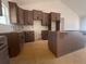 Spacious kitchen with ample new cabinets and a large center island at 610 Presley Farm Pkwy, Rockmart, GA 30153