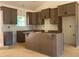 Spacious kitchen showcasing new, well-crafted cabinets and a large island at 610 Presley Farm Pkwy, Rockmart, GA 30153