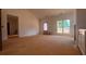 Open-concept living space featuring large windows and an abundance of natural light at 610 Presley Farm Pkwy, Rockmart, GA 30153