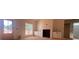 Spacious living room featuring a fireplace, built-in cabinets, and ample natural light at 610 Presley Farm Pkwy, Rockmart, GA 30153