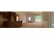 Bright, unfinished living room with vaulted ceilings and large window for ample natural light at 610 Presley Farm Pkwy, Rockmart, GA 30153