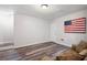 Basement featuring hardwood floors, sofa, and a door to the outside at 1223 Whitlock Ridge Sw Dr, Marietta, GA 30064