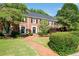 Beautiful brick townhome with black shutters and manicured front yard at 1223 Whitlock Ridge Sw Dr, Marietta, GA 30064
