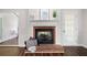 Close-up of brick fireplace with white mantel and hearth in the living room at 1223 Whitlock Ridge Sw Dr, Marietta, GA 30064