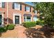 Well-maintained brick townhome boasts classic architectural details and manicured landscaping at 1223 Whitlock Ridge Sw Dr, Marietta, GA 30064