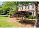 Charming brick front townhome with front yard landscaping and walkway at 1223 Whitlock Ridge Sw Dr, Marietta, GA 30064