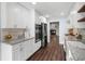 Bright kitchen with granite countertops, stainless steel appliances, and white cabinetry at 1223 Whitlock Ridge Sw Dr, Marietta, GA 30064