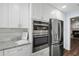 Modern kitchen with stainless steel appliances, granite countertops, and white cabinets at 1223 Whitlock Ridge Sw Dr, Marietta, GA 30064