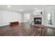 Bright living room with hardwood floors and a brick fireplace at 1223 Whitlock Ridge Sw Dr, Marietta, GA 30064
