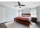 Comfortable main bedroom featuring a ceiling fan, wood floors, and natural light at 1223 Whitlock Ridge Sw Dr, Marietta, GA 30064