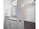 Contemporary powder room featuring granite countertop, modern fixtures, and plenty of storage at 1223 Whitlock Ridge Sw Dr, Marietta, GA 30064