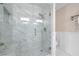 Shower showcasing tile walls, rain shower head, and built-in bench at 1223 Whitlock Ridge Sw Dr, Marietta, GA 30064