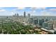 Enjoy this aerial cityscape view, showcasing lush greenery and stunning skyline views at 273 12Th Ne St # 114, Atlanta, GA 30309
