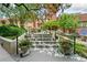 Beautiful exterior featuring stairs with flowers and manicured greenery leading to a lovely brick building at 273 12Th Ne St # 114, Atlanta, GA 30309