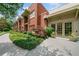 Charming brick building with lush landscaping, featuring a sidewalk and double door entrance, creating an inviting curb appeal at 273 12Th Ne St # 114, Atlanta, GA 30309