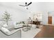 Bright living room featuring hardwood floors, a ceiling fan, and contemporary furnishings at 273 12Th Ne St # 114, Atlanta, GA 30309