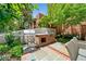 Outdoor kitchen featuring a brick grill, countertop, and lush greenery, creating a perfect spot for outdoor cooking at 273 12Th Ne St # 114, Atlanta, GA 30309