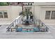 Rooftop patio featuring outdoor seating and planters, creating an inviting outdoor living space with city views at 273 12Th Ne St # 114, Atlanta, GA 30309