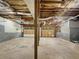 Unfinished basement with exposed ceiling and concrete floors, offering ample space for customization and storage at 339 Warrenton Dr, Douglasville, GA 30134