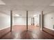 Spacious basement featuring vinyl floors, supportive pillars, white trim, and potential for customization at 339 Warrenton Dr, Douglasville, GA 30134