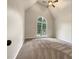 Spacious bedroom with vaulted ceilings, a large window, and neutral carpet at 339 Warrenton Dr, Douglasville, GA 30134