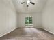 Bright bedroom with vaulted ceilings and large window at 339 Warrenton Dr, Douglasville, GA 30134