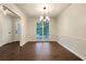 Bright dining room features hardwood floors, classic wainscoting, and chandelier lighting at 339 Warrenton Dr, Douglasville, GA 30134