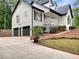 Charming home with dark trim, two-car garage, front porch, and landscaped yard offering a welcoming curb appeal at 339 Warrenton Dr, Douglasville, GA 30134