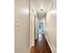 Hallway with hardwood flooring and modern lighting at 339 Warrenton Dr, Douglasville, GA 30134