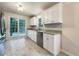 Well-lit kitchen featuring stainless steel appliances, granite countertops, and bright white cabinetry at 339 Warrenton Dr, Douglasville, GA 30134