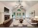 Bright living room with vaulted ceilings, a stone fireplace, and stylish furniture creates a cozy and inviting atmosphere at 339 Warrenton Dr, Douglasville, GA 30134