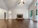 Bright living room featuring hardwood floors, stone fireplace, and vaulted ceiling at 339 Warrenton Dr, Douglasville, GA 30134
