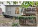 Spacious backyard featuring a deck, sunroom and attractive landscaping, perfect for entertaining at 3565 Hickory Branch Trl, Suwanee, GA 30024