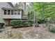 Beautiful backyard featuring a deck, sunroom and well-manicured landscaping for outdoor enjoyment at 3565 Hickory Branch Trl, Suwanee, GA 30024
