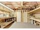 Unfinished basement with shelving and ample space for storage or customization at 3565 Hickory Branch Trl, Suwanee, GA 30024