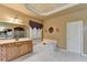 This bathroom features double sinks, a garden tub with jets, and a private toilet at 3565 Hickory Branch Trl, Suwanee, GA 30024