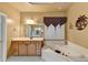 Bathroom featuring double sinks, a garden tub with jets, and a tiled floor at 3565 Hickory Branch Trl, Suwanee, GA 30024