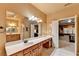 Bright bathroom features long vanity with double sinks and a large mirror at 3565 Hickory Branch Trl, Suwanee, GA 30024