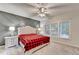 Inviting bedroom featuring a gray accent wall and bright natural light at 3565 Hickory Branch Trl, Suwanee, GA 30024