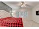 Inviting bedroom featuring a gray accent wall and bright natural light at 3565 Hickory Branch Trl, Suwanee, GA 30024